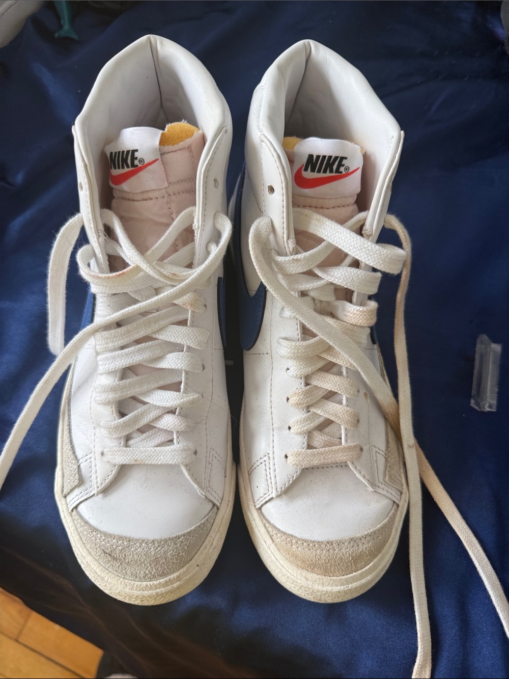 Nike White High-Top Sneakers with Black Swoosh and Red Logo